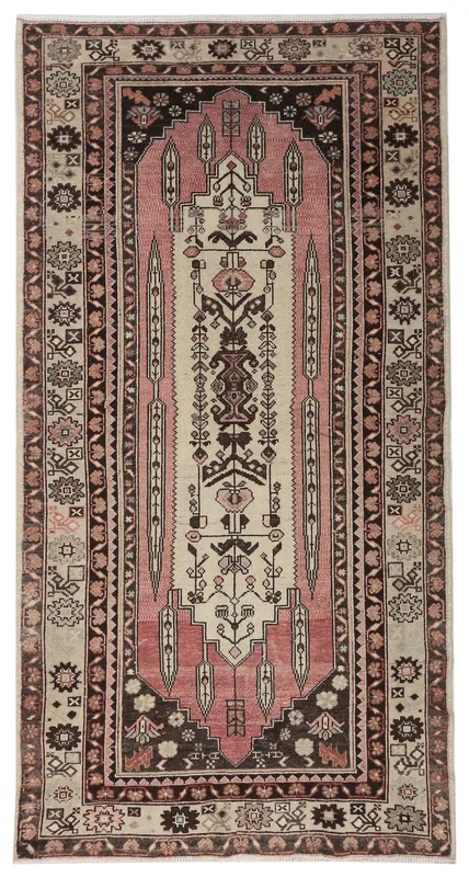 Top view of a 4'4" x 8'3" vintage Anatolian rug with rose and beige colors