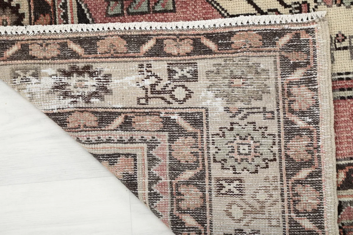 Close-up of the rug's back, revealing the intricate hand-knotted construction