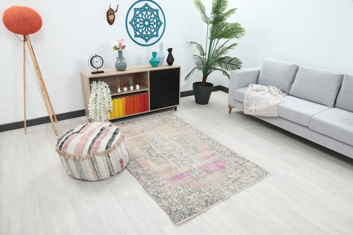 Angled view of the Tan Rose Medallion rug enhancing a modern living space