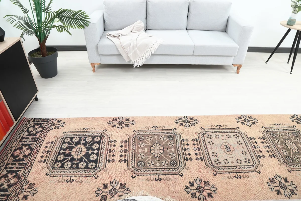 Overhead view of the runner rug in a room, showcasing the sequence of geometric panels.