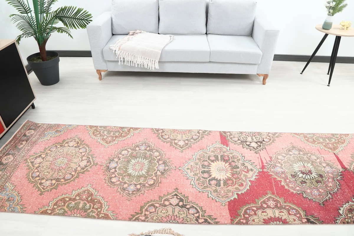Overhead view of the vintage runner rug in a room, showing its full length from a higher perspective