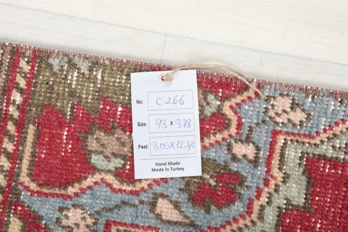Close-up of the rug's surface with a product tag showing dimensions and origin