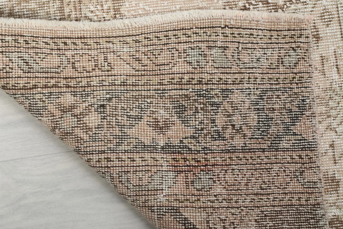 Underside of the runner, showing the hand-knotted construction and cotton foundation details.