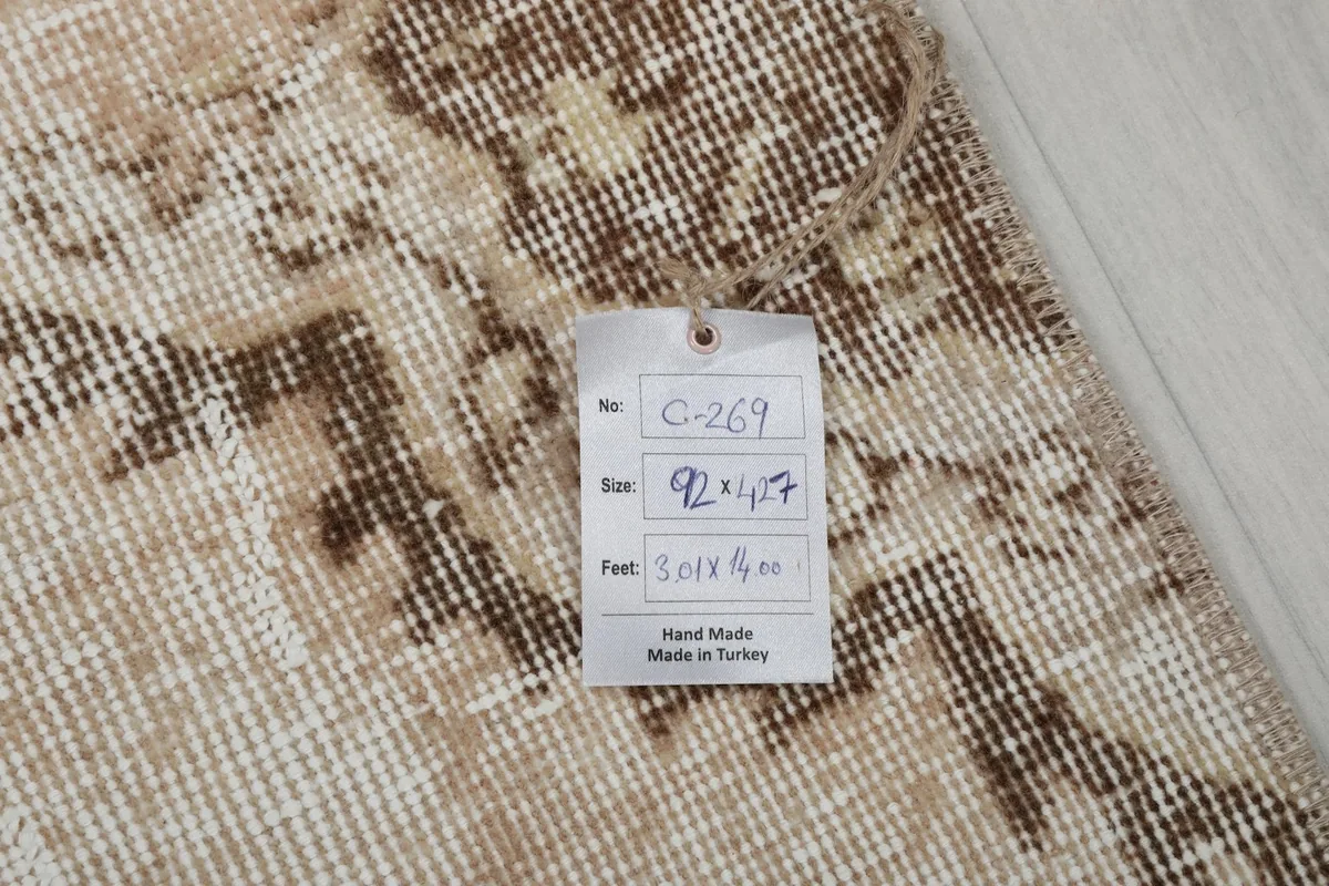Rug tag displaying the dimensions 92 x 427 cm (3'0" x 14'0") and origin 'Hand Made in Turkey'.