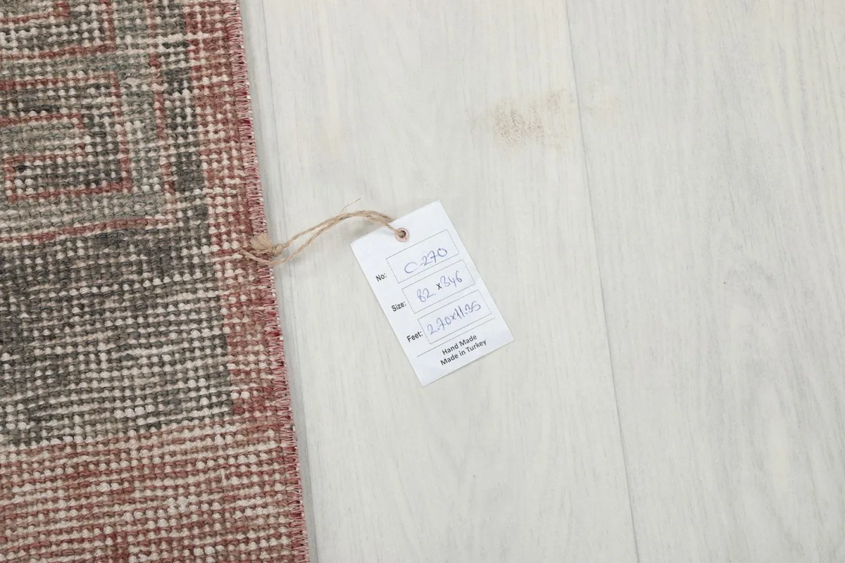 Product tag attached to the rug, showing details like origin and material.
