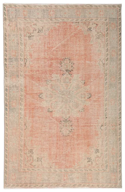 Full top view of the 5'0" x 7'7" vintage rose and beige Anatolian area rug.