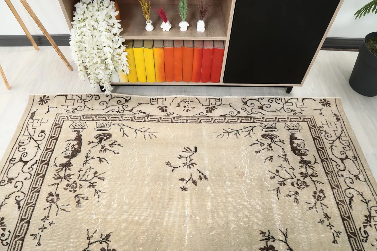 Detailed angle view of the rug's upper section and border in a room.