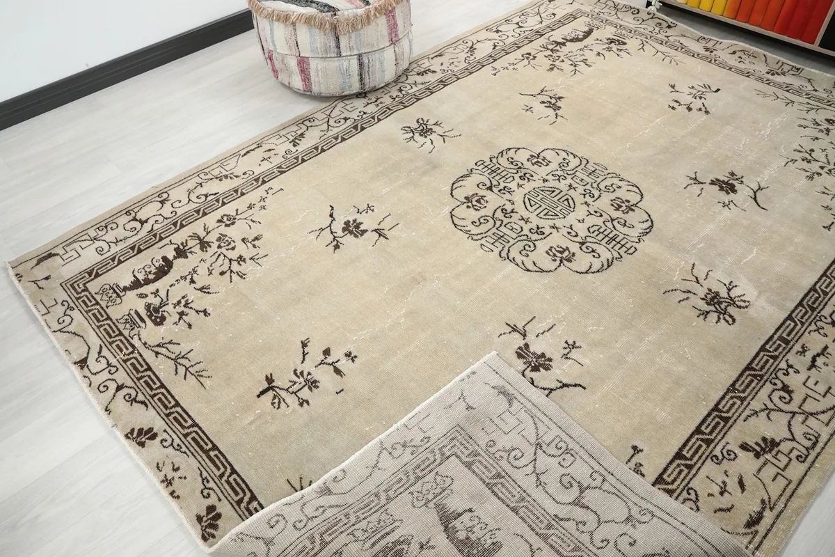 View of the rug with a corner folded to reveal the reverse side and thickness.