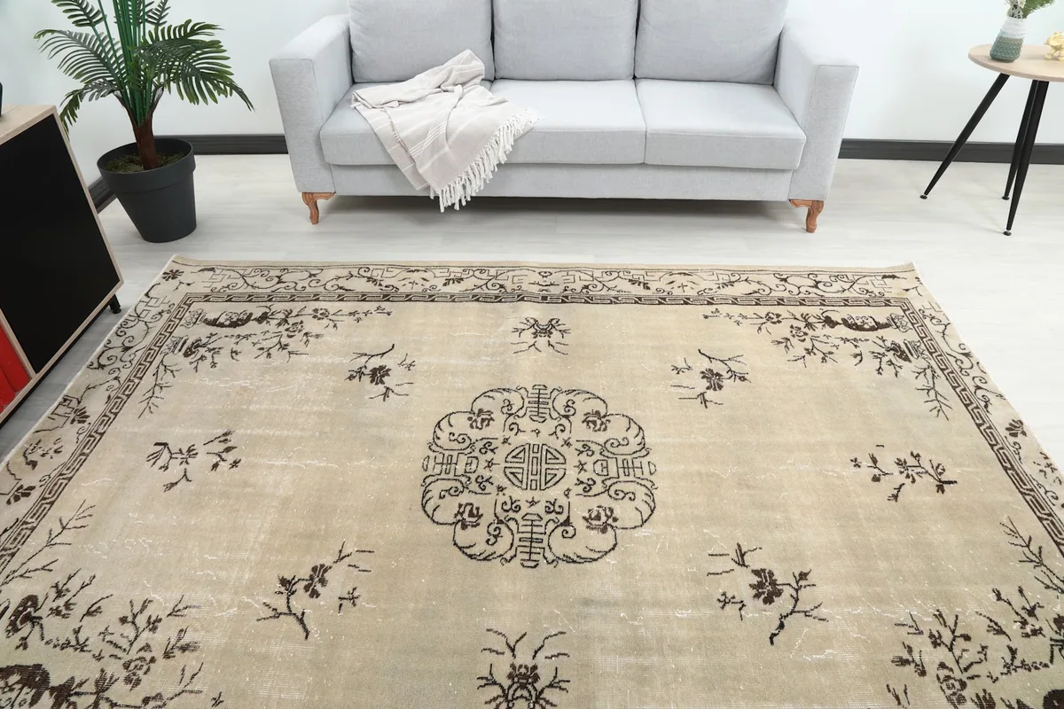 Overhead view of the rug showcasing its full pattern and colors within a room.