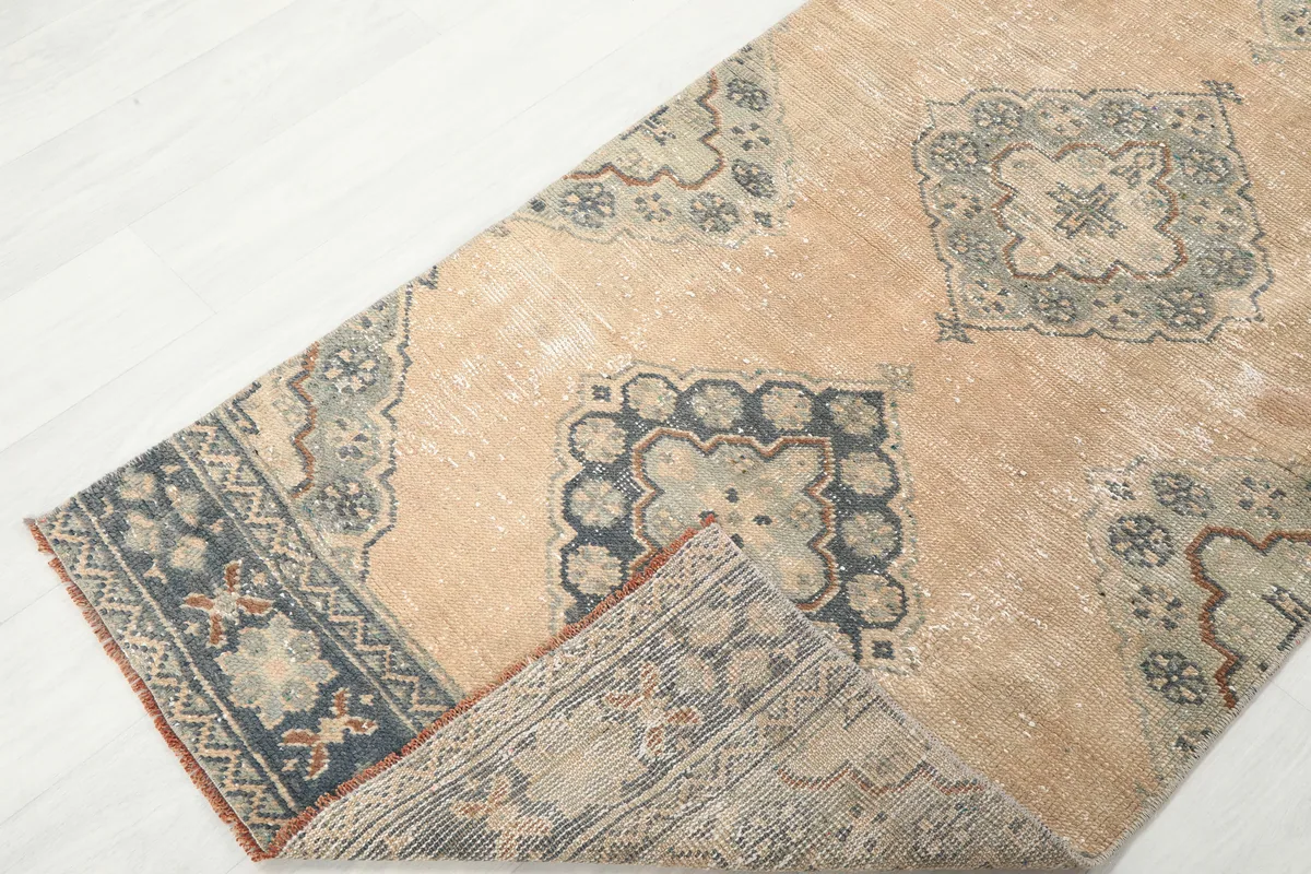 Warm Beige Geometric Anatolian Runner folded to show back and front patterns