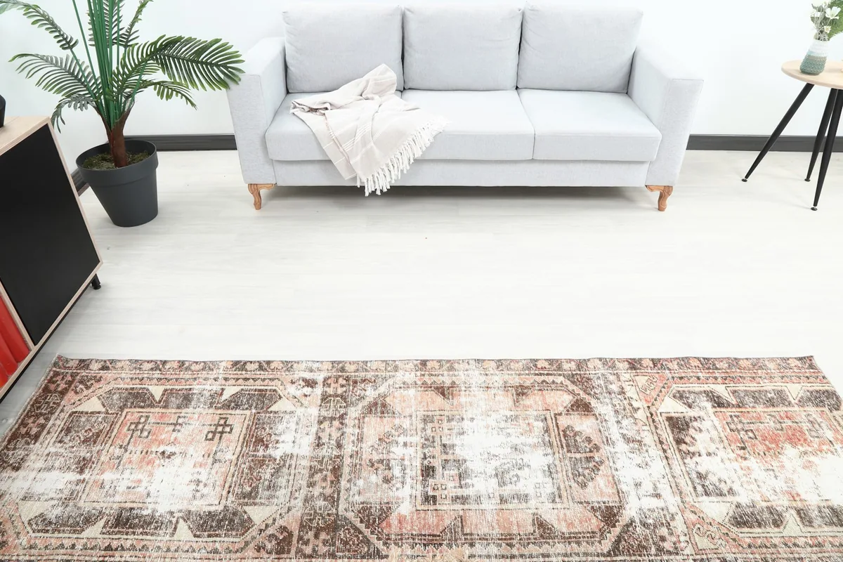 Overhead view of the runner rug in a room, displaying its geometric pattern and overall length.