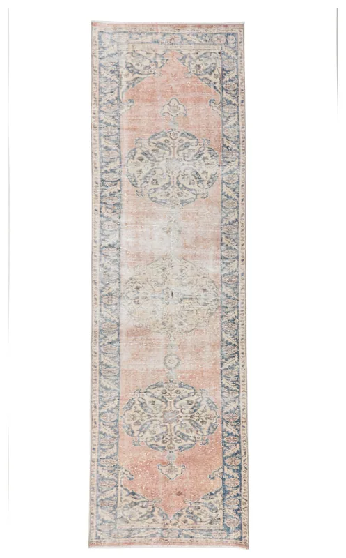 Full overhead view of the vintage Anatolian runner rug with rose field and navy medallions