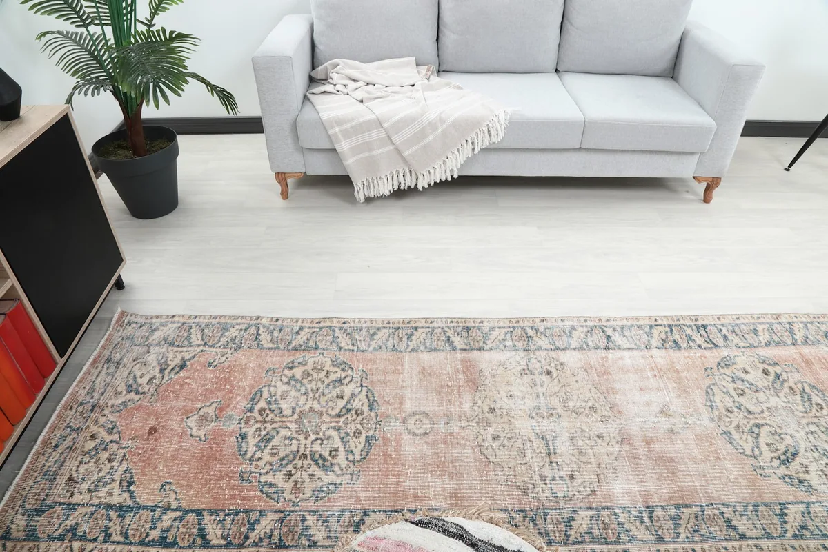 Overhead view of the runner rug in a room, highlighting its position relative to a couch