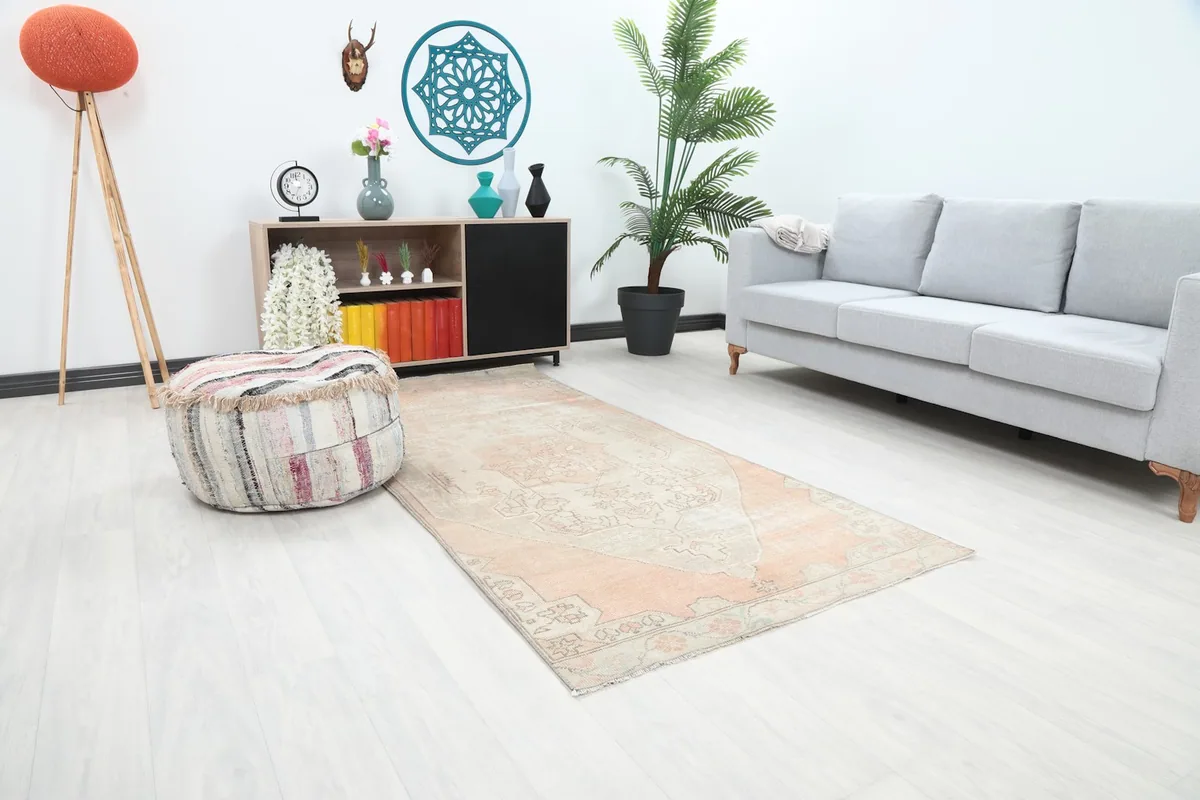 Angle view of the orange and ivory rug in a modern living space