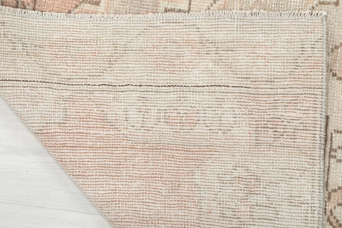 Underside of the rug displaying the hand-knotted cotton foundation weave
