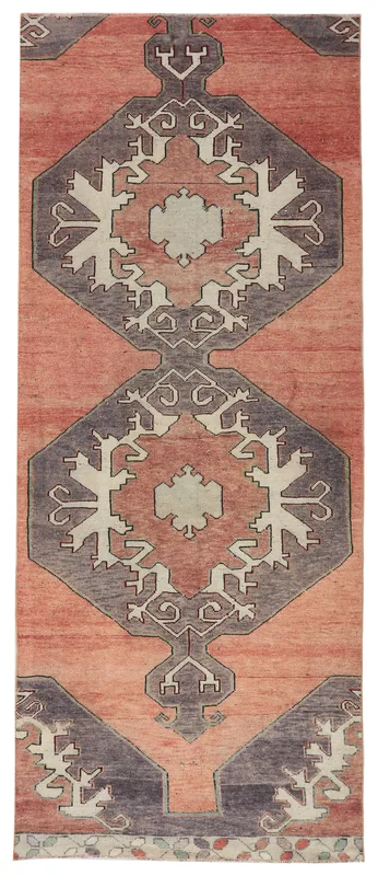 Full overhead view of the rust and gray geometric Anatolian runner rug on a white background