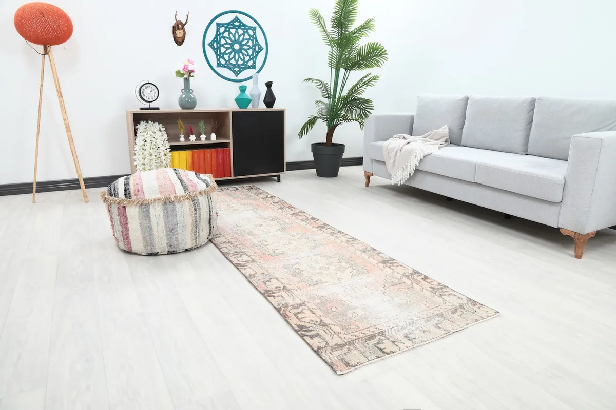 Angle view of the runner rug placed in a room with light flooring