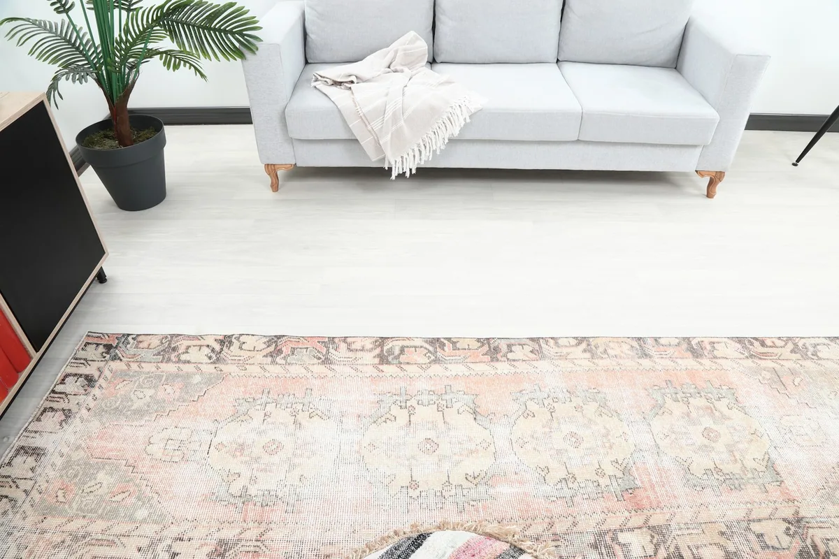 Overhead view of the runner rug extending from a sofa