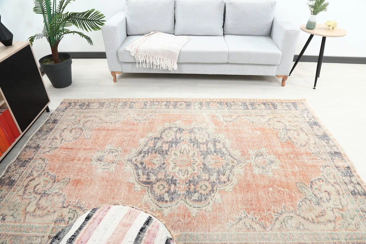 Overhead view of the rug in a room, highlighting the central medallion and overall pattern