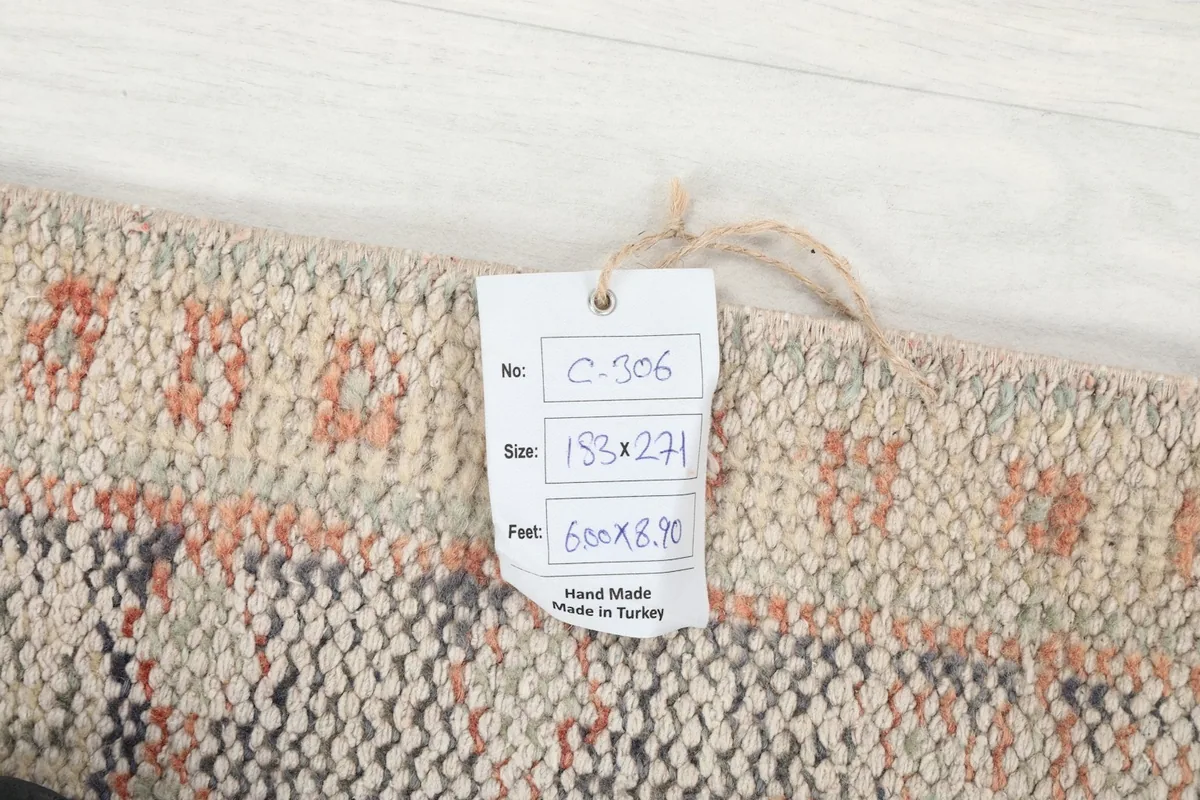 Close-up of the rug's tag, showing size and origin details