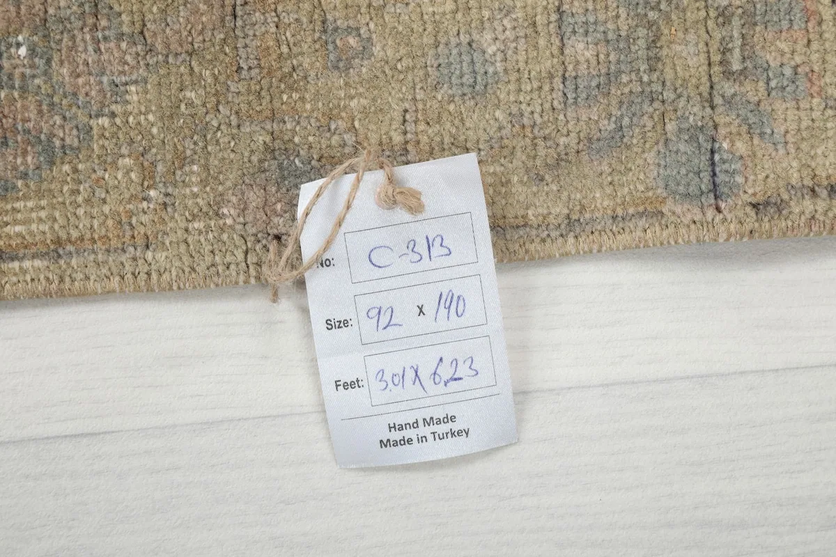 Size tag for the 3'0" x 6'3" rug, indicating it is hand-made in Turkey.