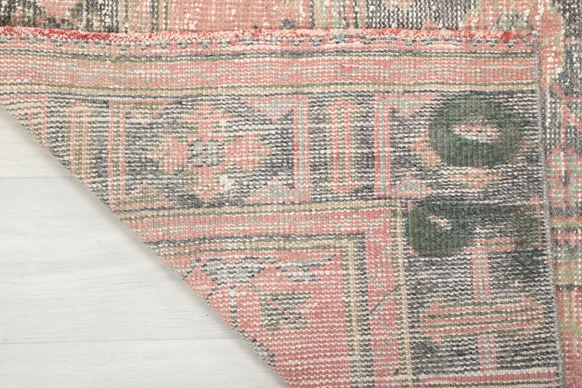 Underside of the Faded Rose Geometric Anatolian Runner, revealing the hand-knotted cotton foundation.
