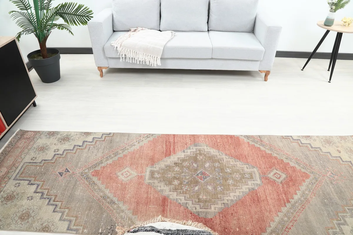 Overhead view of the runner rug in a room, capturing the full central geometric motif and surrounding decor.