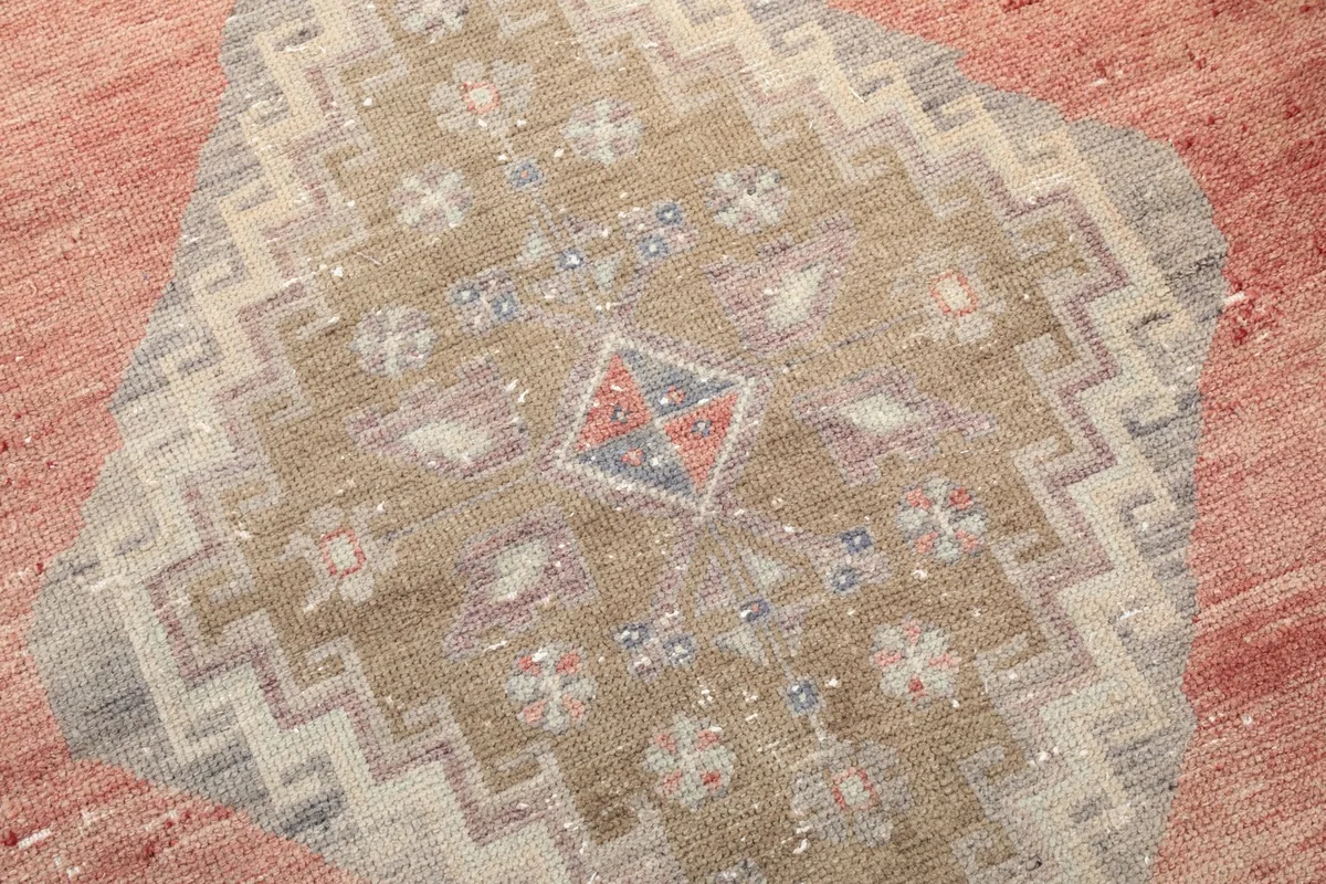 Detailed close-up of the central diamond motif, showcasing the intricate geometric patterns and color variations.
