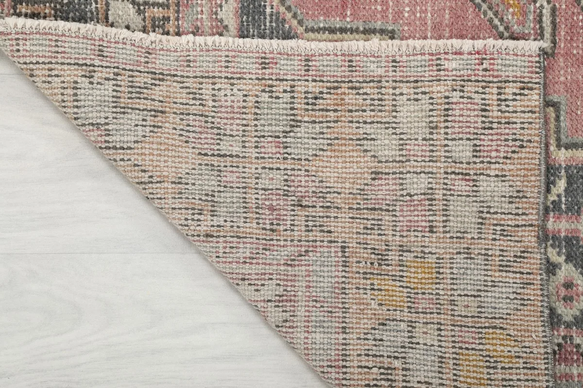 Underside view of the hand-knotted cotton foundation of the Anatolian runner