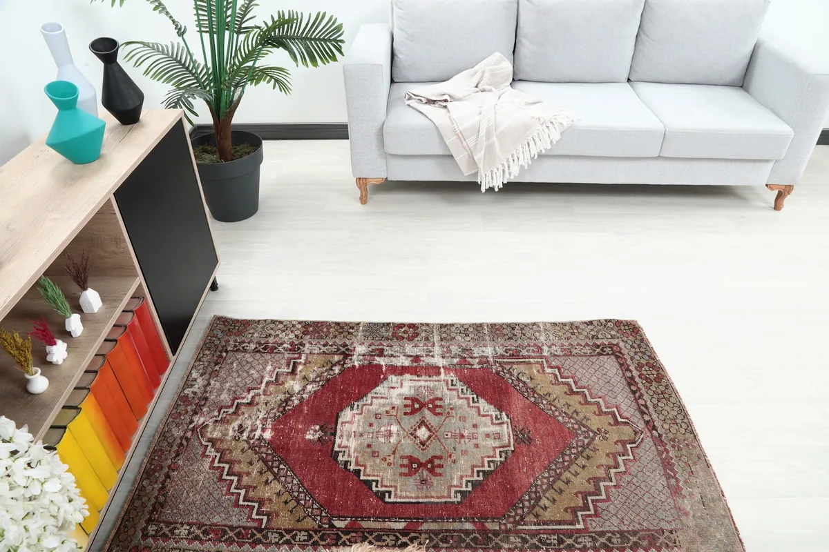 Overhead view of the Red Beige Tribal Medallion rug in a room, showing its placement relative to furniture
