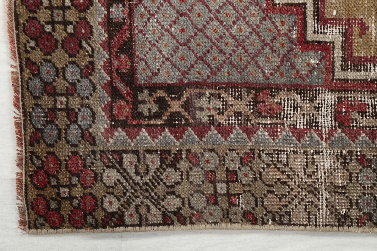 Detail of the outer border design, showing geometric patterns and color variations