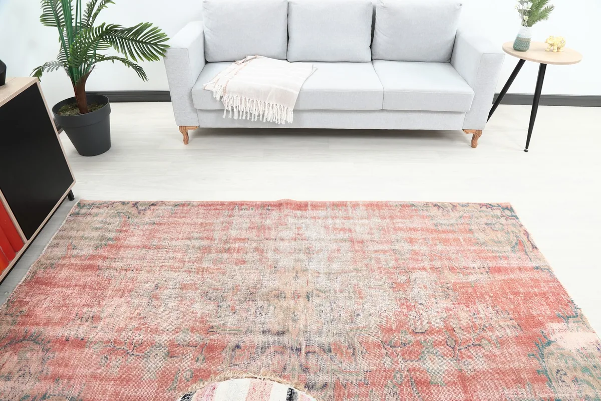 Overhead view of the vintage area rug showcasing its full length in a room setting.