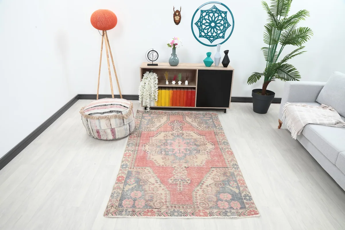 Vintage Anatolian rug displayed in a living room setting with modern furniture