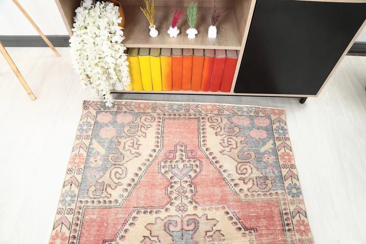 Overhead view of the vintage rug's top half, showcasing the intricate central design