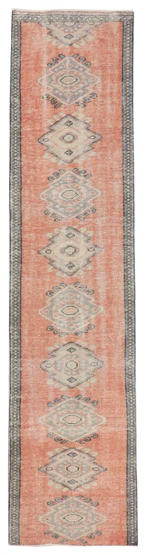 Full top view of the 2'6" x 10'8" rust geometric runner rug on a white background