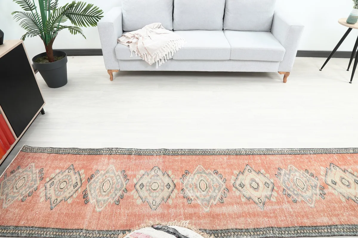 Overhead view of the runner rug in a room, showing its geometric pattern and colors