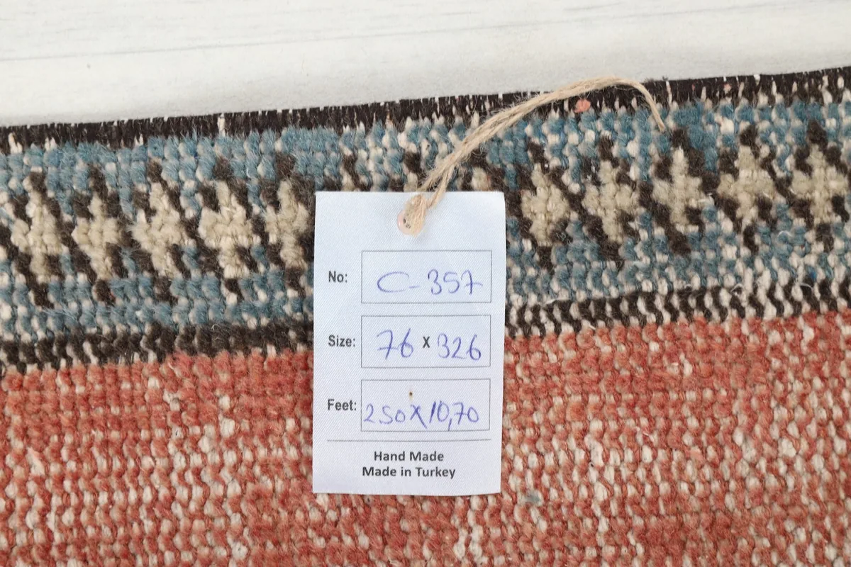 Close-up of the rug's back with a tag displaying product number and dimensions