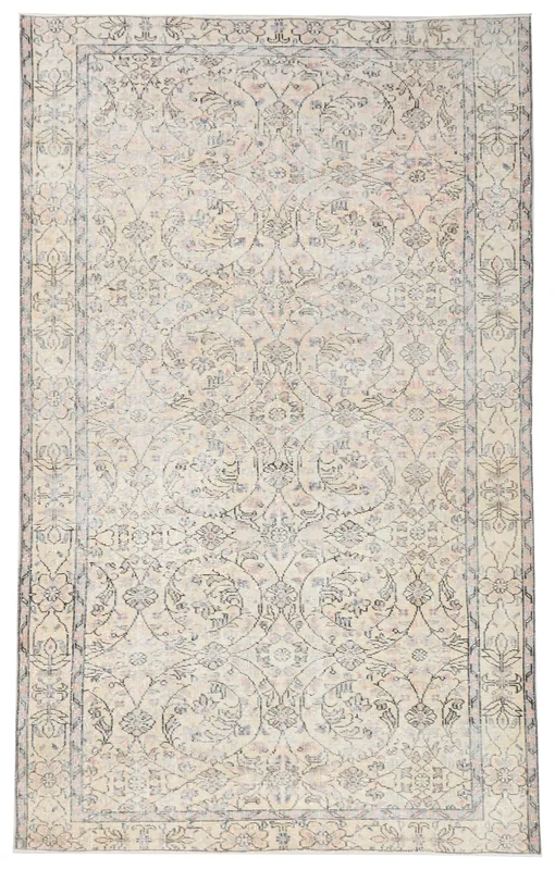 Full overhead view of the 5'2" x 8'4" ivory vintage Anatolian rug with floral and medallion patterns.