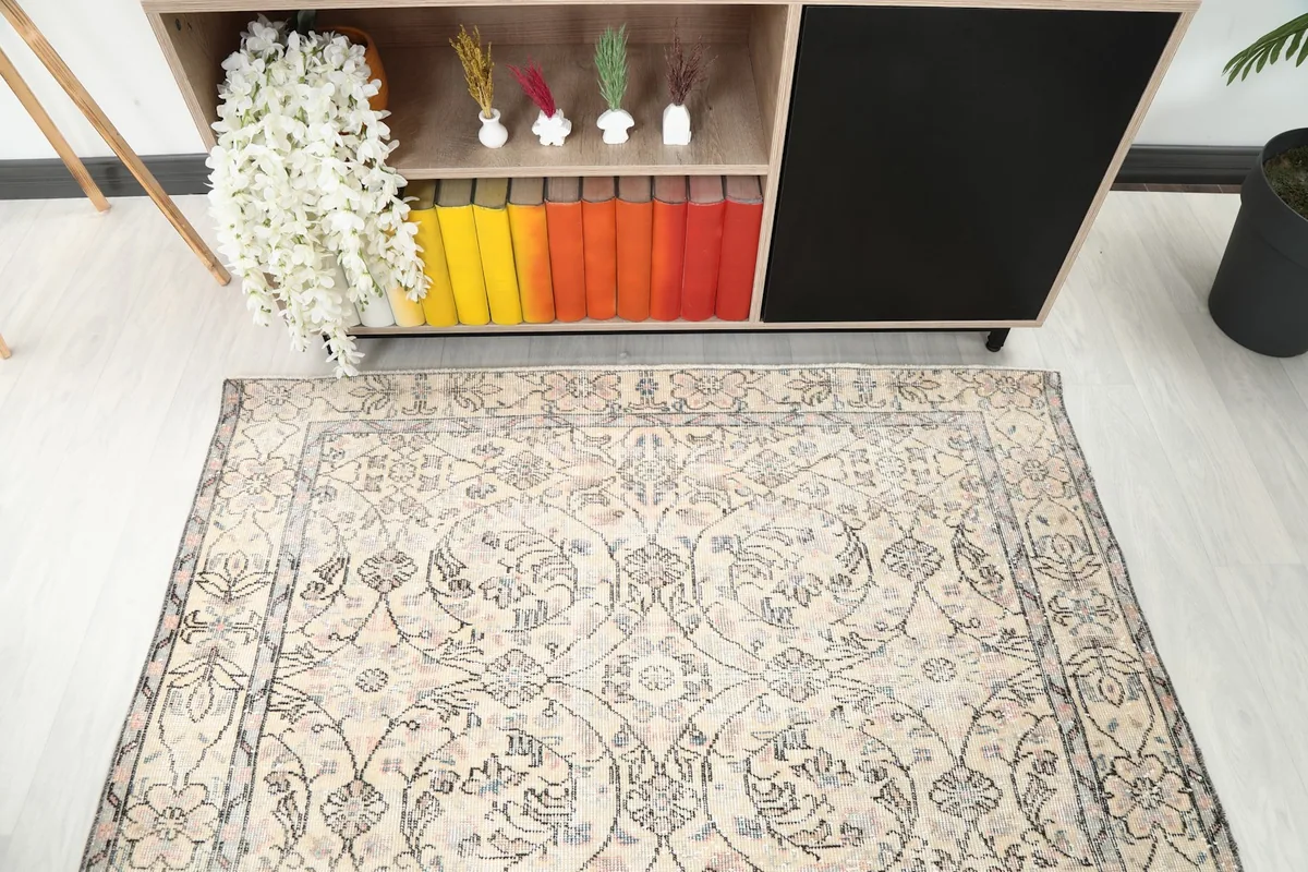 Overhead detail of the rug's central design and colors, highlighting the floral motifs.