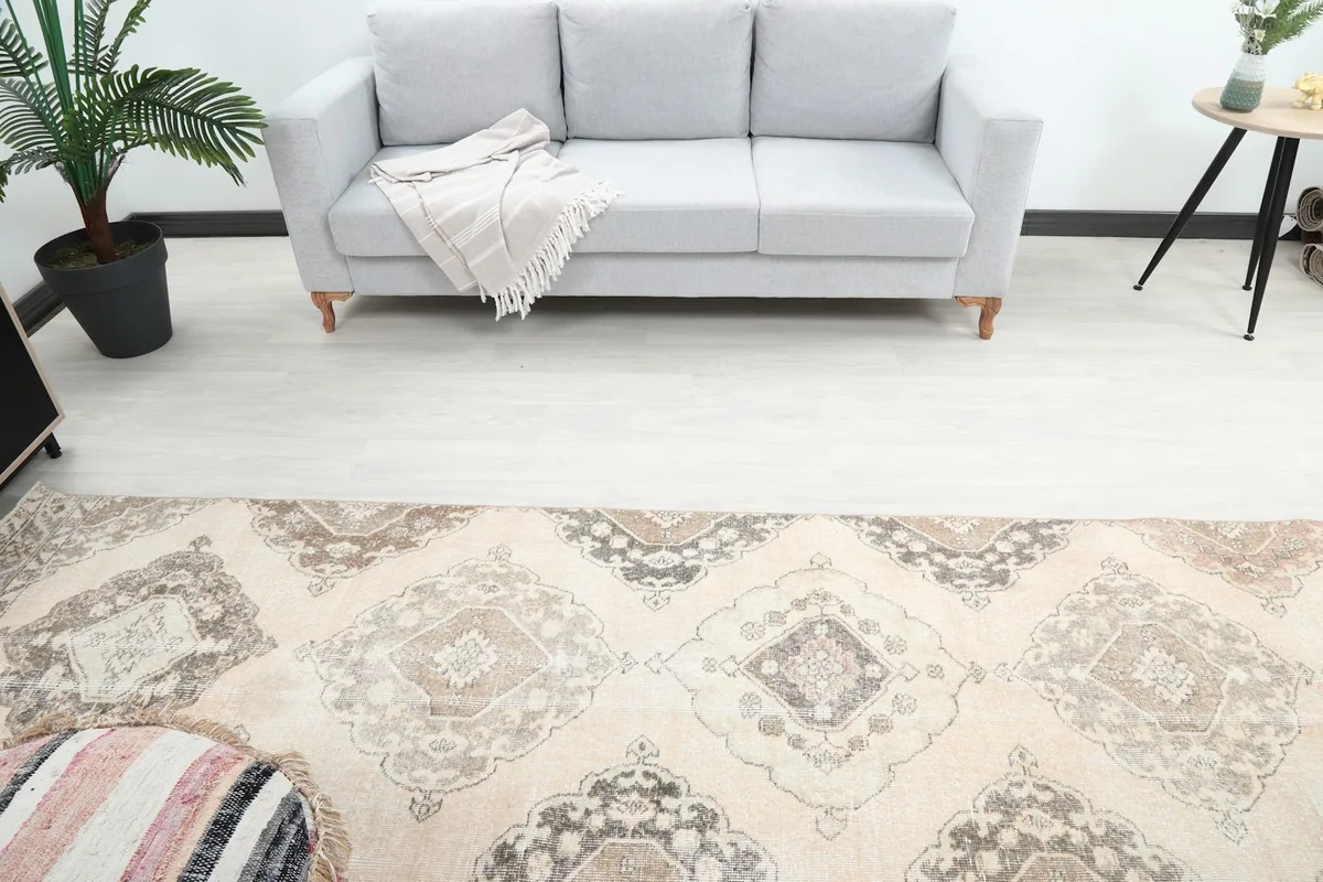 Overhead view of the runner rug's center, showing the repeating medallion design in a living space