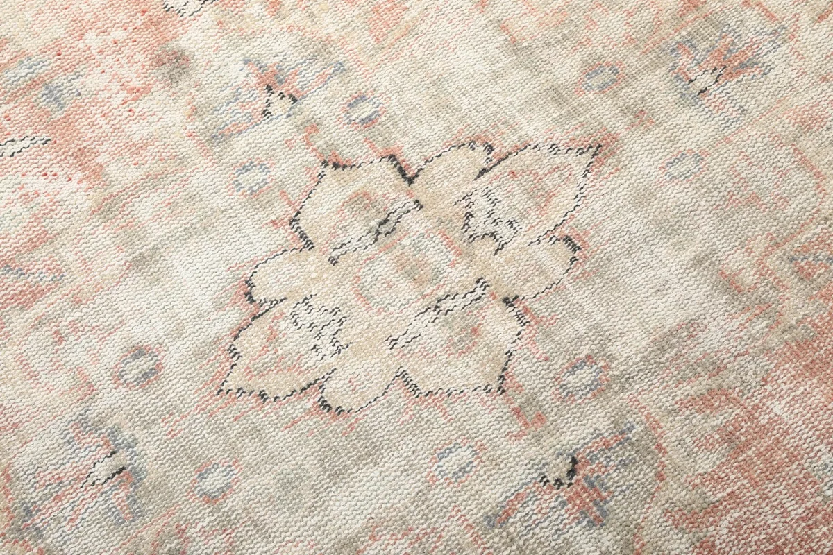 Close-up of a small motif on the vintage Anatolian rug, showing individual knots and color variation