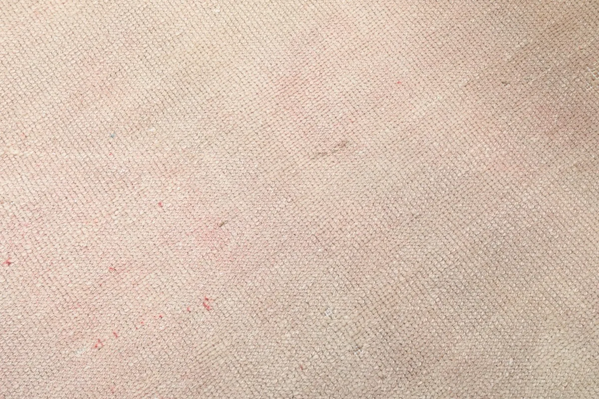 Detailed close-up of the low wool pile, showing the texture and slight color variations.