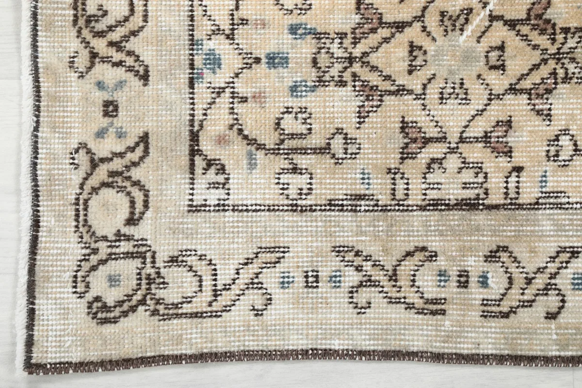 Corner detail of the rug's intricate border design and field pattern
