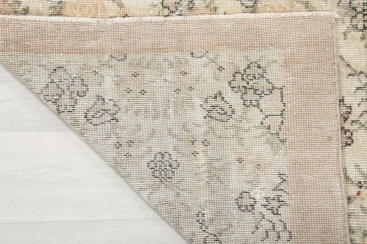 Underside of the rug, showing the cotton foundation and knotting detail
