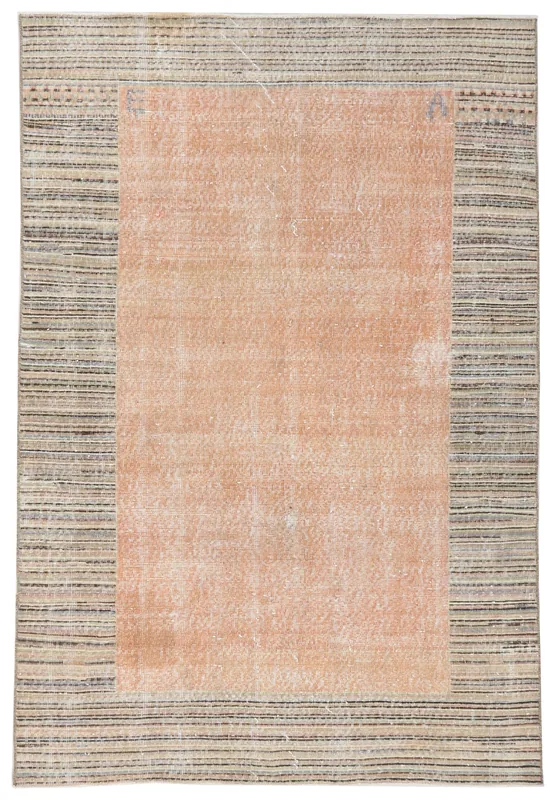Top-down view of the 5x7 vintage Anatolian rug with a rust field and striped beige and charcoal border.