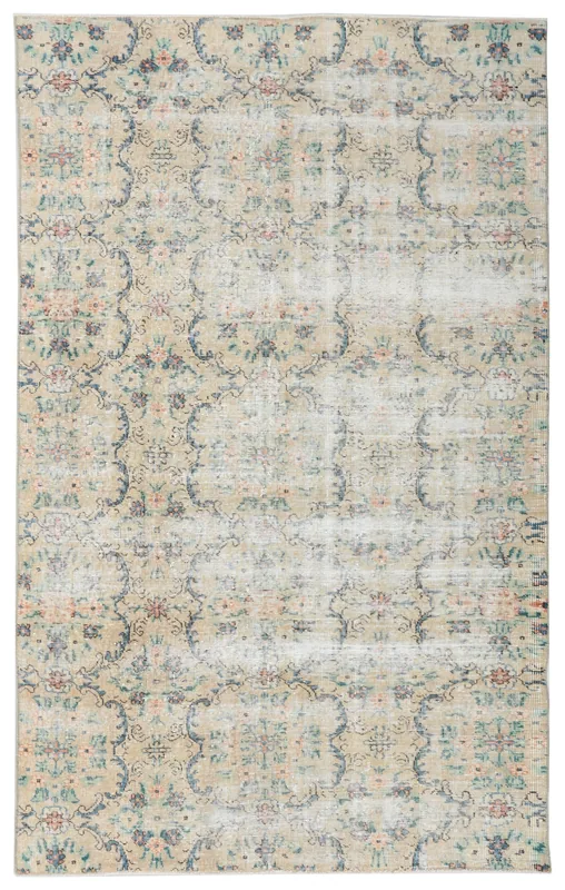 Full overhead view of the 5x8 beige floral vintage Anatolian rug on a white background