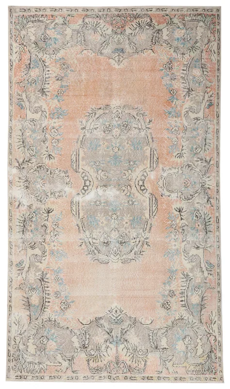 Top view of the 5'9" x 10'0" vintage Anatolian rug with rust field and gray-blue floral medallion pattern