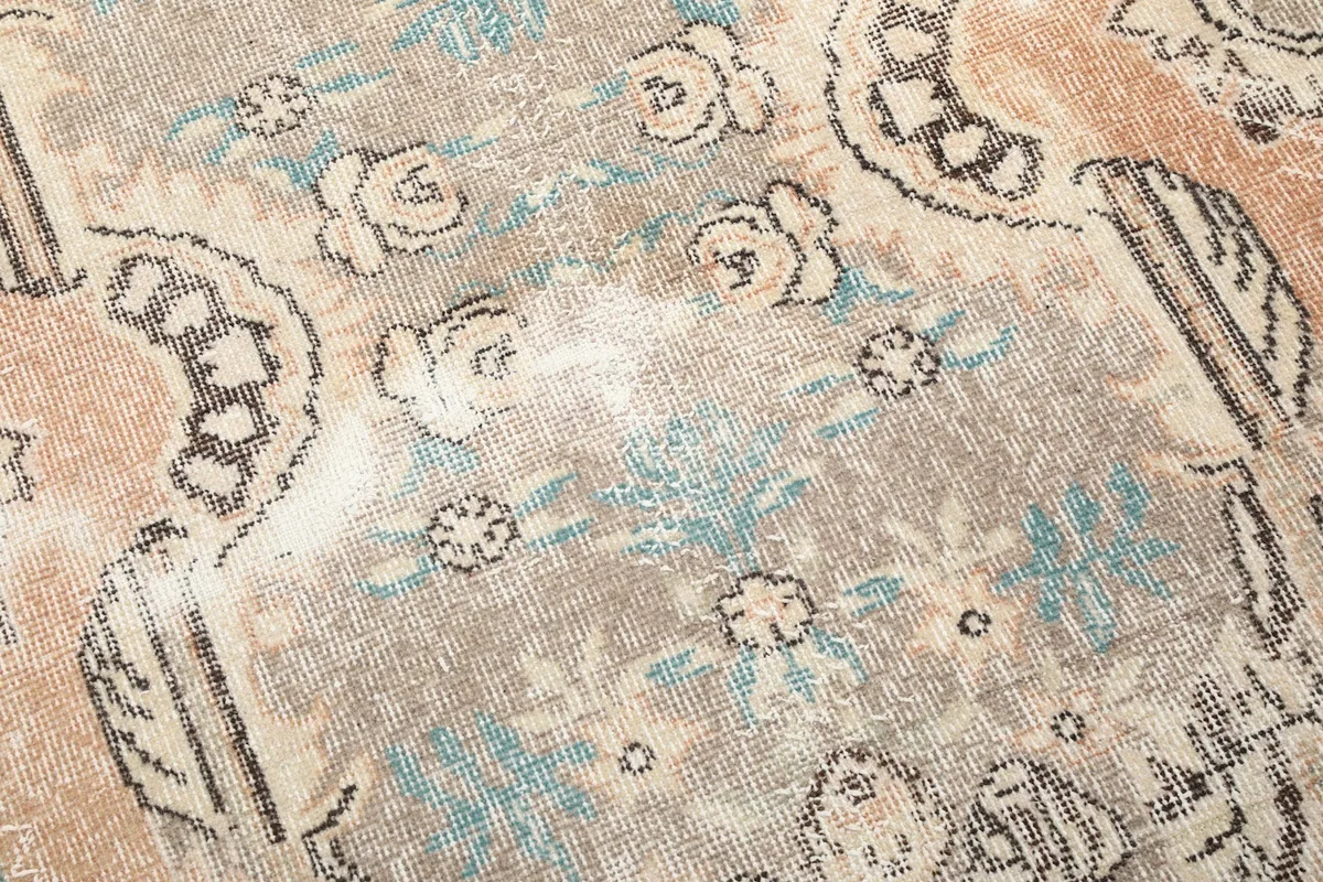 Detailed view of the low wool pile, showing the hand-knotted texture and color variations