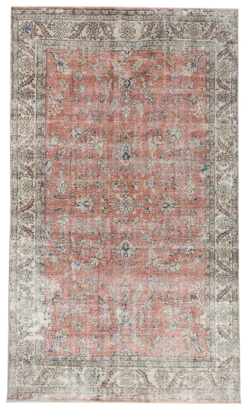 Full overhead view of the 6'6" x 10'11" vintage rust and beige floral Anatolian rug on a white background.