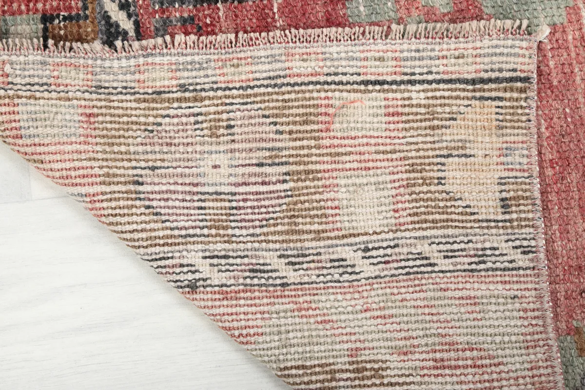 View of the back of the Faded Rose Floral Anatolian Runner, revealing the hand-knotted construction and foundation.